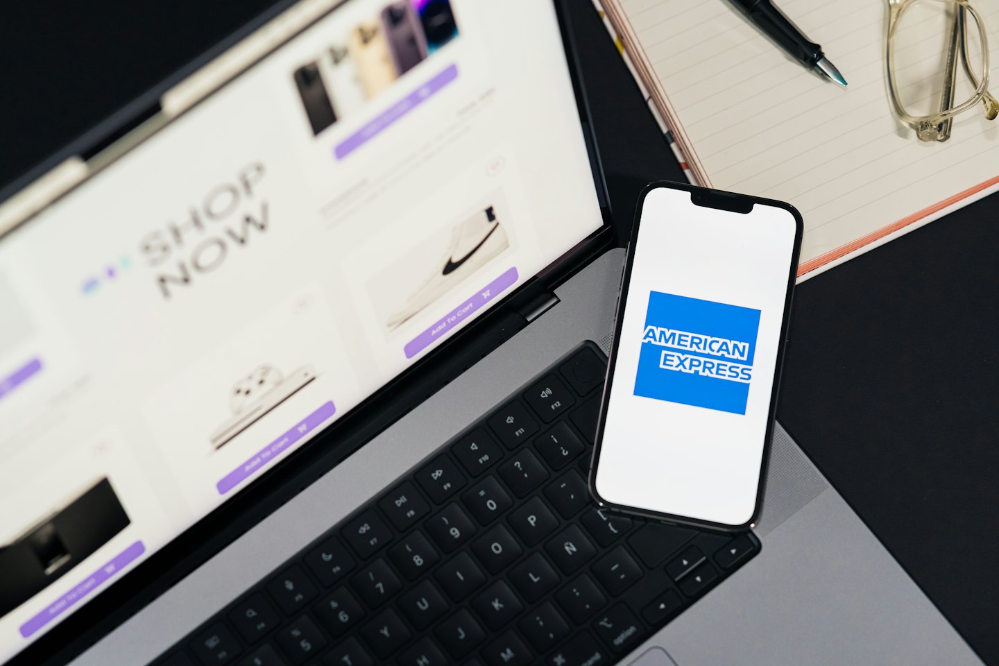 Laptop showing an online store next to a smartphone.
